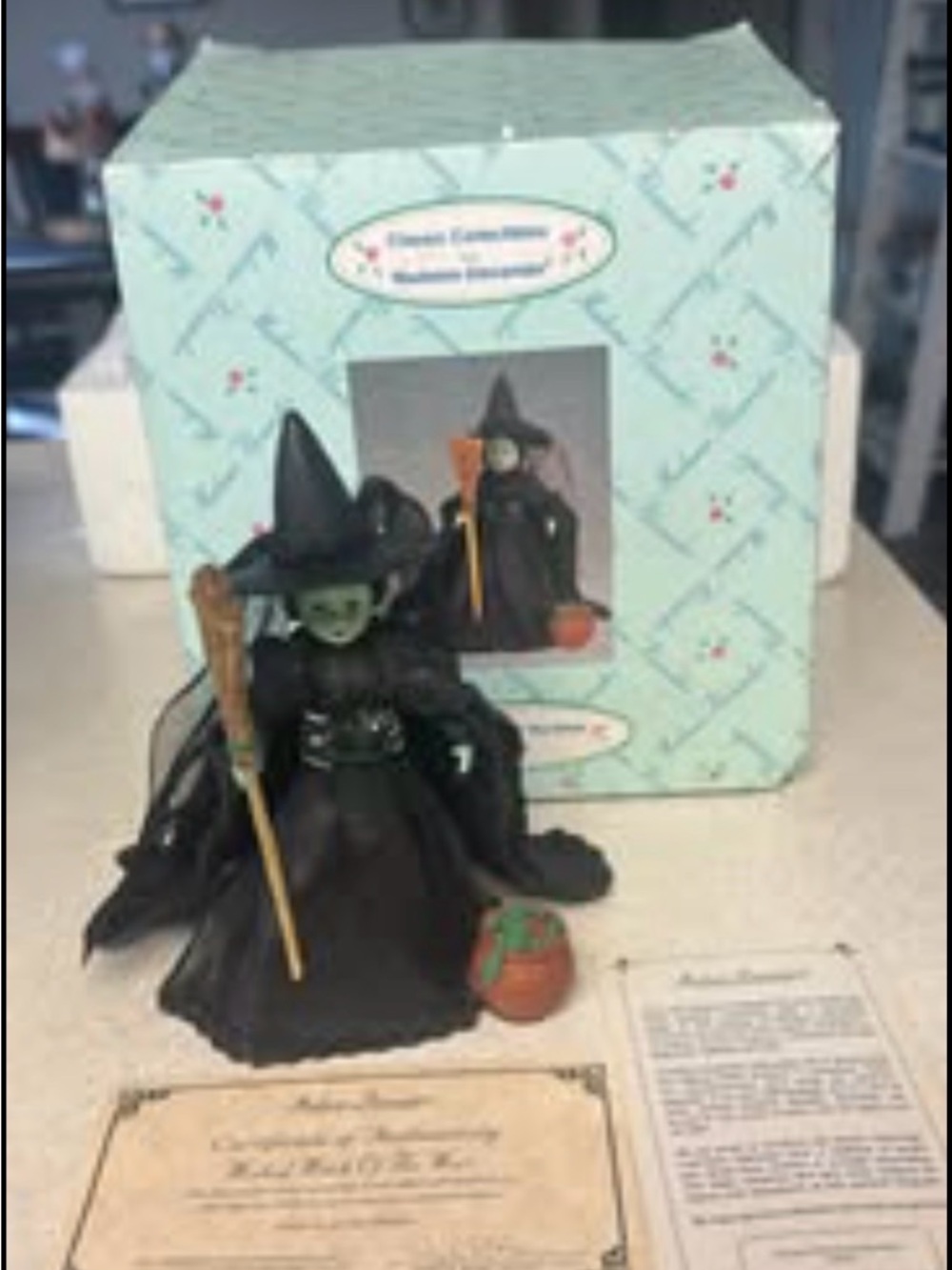 Madame Alexander Black Witch Figurine with Green Face and Orange Pumpkin